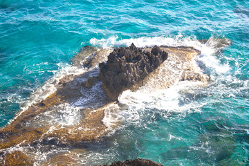 rocks washed by sea waves. Turquoise clear water, vacation, seascape