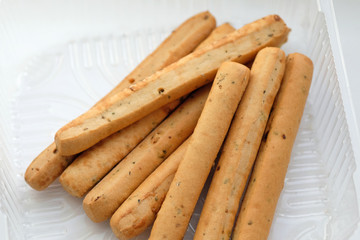 Delicious Italian bread sticks in plastic packaging. grissini snack top view.