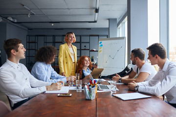 Business co-workers work together in business office, conference office, wearing formal wear and...