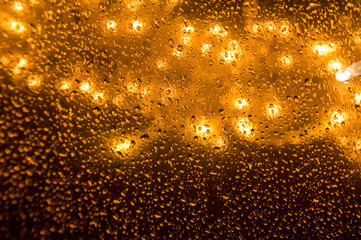 Light illumination. Christmas garlands. Raindrops on a New Year's garland. Light garlands.