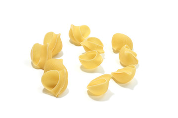 A lot of italian's raw pasta(macaroni) conchiglie on a white background