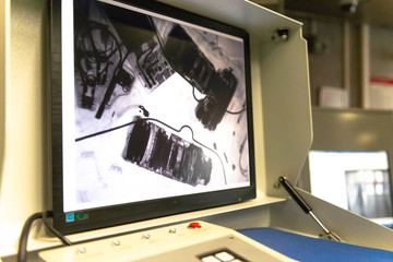 Photographer's backpack. Lenses and camera under x-ray. Checking personal belongings.
