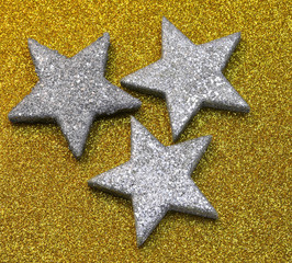 Silver Stars on the glitter golden background