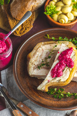 Tasty baking pork lard bacon fatback with black pepper and other herbs and spices in ceramic dish. Traditional Ukrainian, Hungarian, Polish or other Eastern Europe national dish