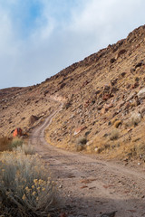 ascending dirt road on rocky hillside in rural California