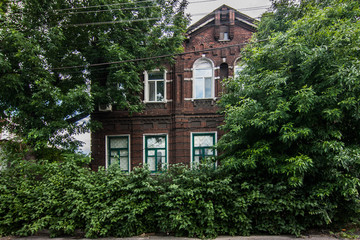 Old brick house with garden in Mariupol, Ukraine
