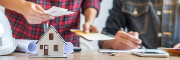 Interior designer and Architect choosing color in color swatch samples chart for house coloring...