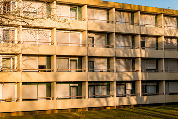 Facade of an apartment building at sunset