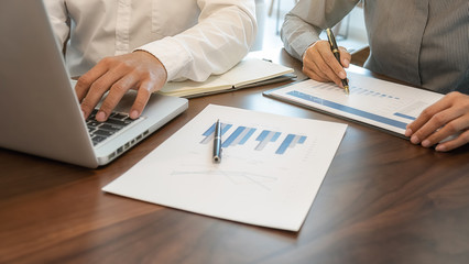 Business team brainstorming and discussing with financial data and report graph. Teamwork meeting...