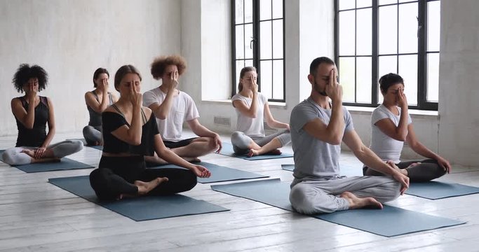 People touch Ajna chakra opening the third eye meditating together