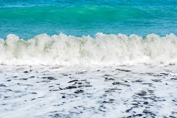 Beautiful waves foaming, water swallow as a background.