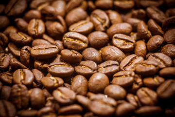 Brown coffee beans, of coffee beans for background and texture. Beans of roasted black coffee. Background.