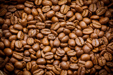 Premium quality light roasted coffee beans rotating. Close up of brown roasted coffee beans