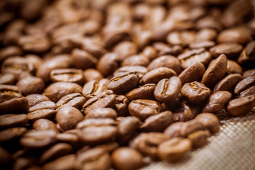 Beans of roasted black coffee. Background. Brown coffee beans, of coffee beans for background and texture.