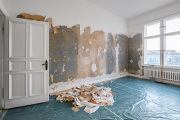 old room during renovation removing wallpaper -