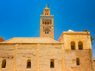 Fototapeta premium Koutoubia Mosque minaret at medina quarter of Marrakesh, Morocco. Blue sky is in the background.