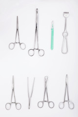 Surgical instruments on white background. Stainless steel surgical instruments on white background. Scalpel, scissors and other surgery tools
