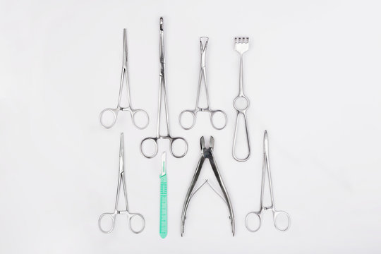 Metal surgical instruments on white background. Stainless steel surgical instruments on white background