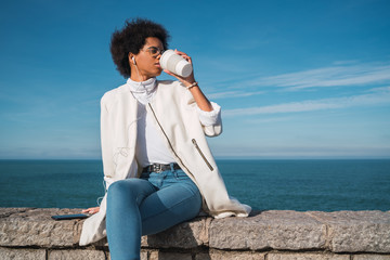 Woman listening to music with earphones.