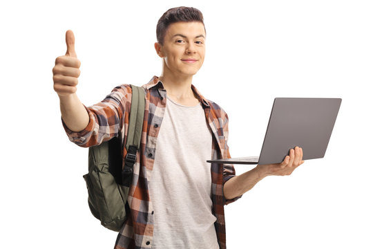 Male Student Gesturing A Thumb Up And Holding A Laptop Computer