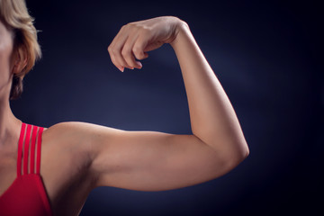 Woman in red top showing part of hand. Fitness and health concept