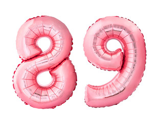 Number 89 eighty nine of rose gold inflatable balloons isolated on white background. Pink helium balloons forming 89 eighty nine number