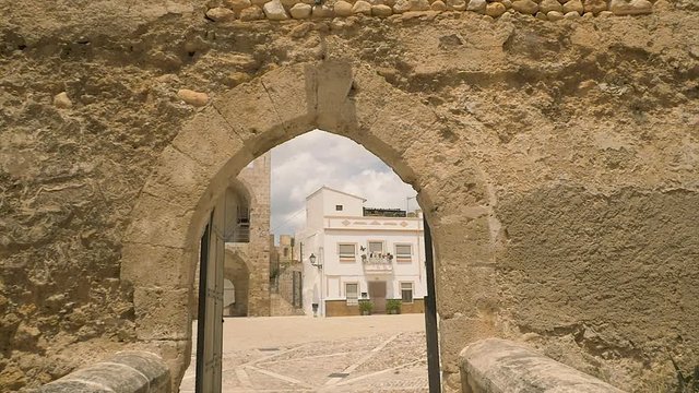 Walking into attractive, touristic, medieval castle in Spain in a small city of Bunyol or Bunol near Valencia that is famous for hosting the Tomatina festival held annually in August. 