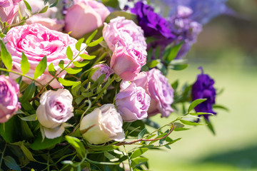 Bouquets of fresh flowers decoration of the festive table. Celebrating an open air party. Decor Details