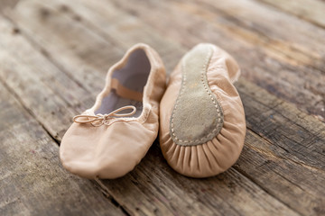 ballet shoes  laying on rough vintage wood, with natural light, Ballet shoes for Kids