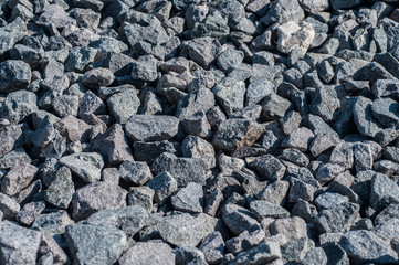 Gray limestone gravel closeup in sunny day