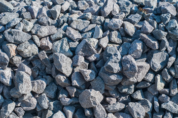 Gray limestone gravel closeup in sunny day