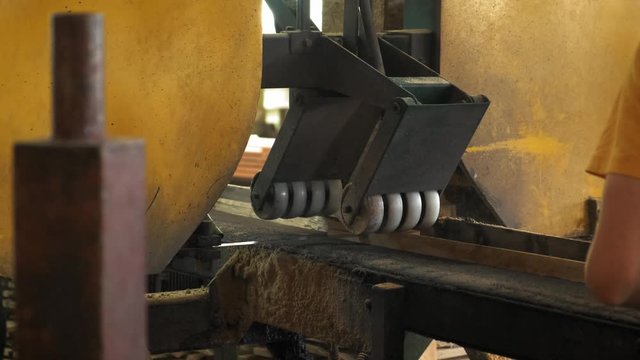 Woodworking factory. Cutting boards into rectangular slats. Slow motion. 4k