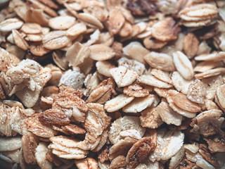 Close-up of granola, breakfast dish, snack. On the photo is a granule of oatmeal and honey. Application in the packaging of products as well as banners and articles for websites.