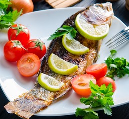 Fried fish served on the plate