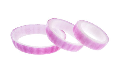 Sliced red onion rings isolated on white background.