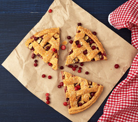 slice pie cranberry. Blue wooden background