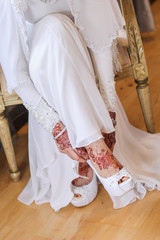 Very beautiful and unique henna paintings on both hands of the bride.