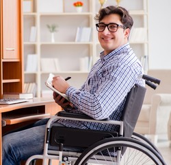 Disabled student studying at home on wheelchair