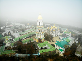 Foggy view of the Kyevo Pecherska Lavra Monastery in Kiev, Ukraine, Fog Autumn Winter Dramatic weather