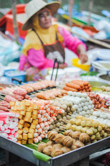 a variety of foods sold in the very popular floating market in Thailand.