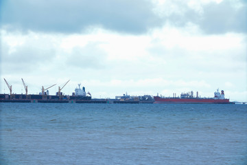 Fototapeta premium Cargo ship loading product at port