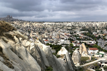 Fototapeta premium Goreme, Turkey - 09/15/2019: Volcanic rocks of an unusual shape in the vicinity of the village of Goreme in the Cappadocia region in Turkey.