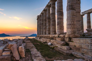 Sounion, Attica / Greece: Colorful sunset at Cape Sounion with the Temple of Poseidon. One of the Twelve Olympian Gods in ancient Greek religion and myth. God of the sea, earthquakes. Nobody, Aegean