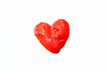 Red glitter slime in the form of a heart on whit background. Toy antistress. Toy for the development of hand motor skills.