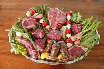 raw meat and vegetables surf and turf