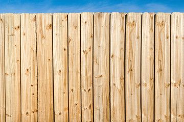 Pine wooden fence close up background.