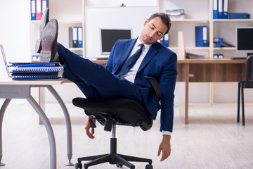Young male businessman working in the office