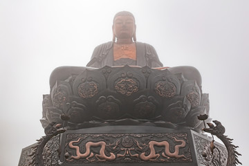 Giant Buddha statue on the top of Fansipan mountain peak, Sapa, Vietnam