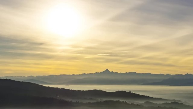 Mountains at Sunset with clouds and fog