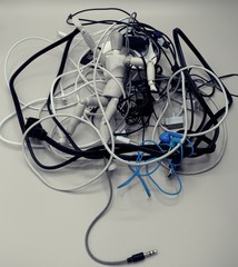 Drawing mannequin trapped within a pile of wires, with only the blue color in highlight